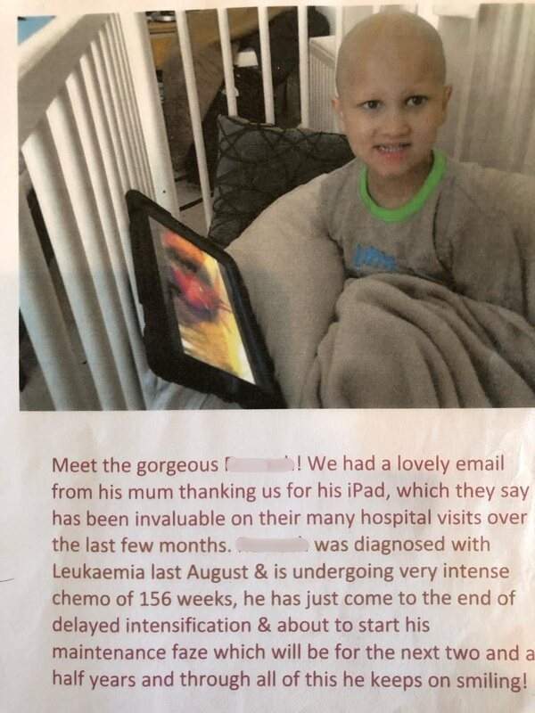  smiling with his iPad